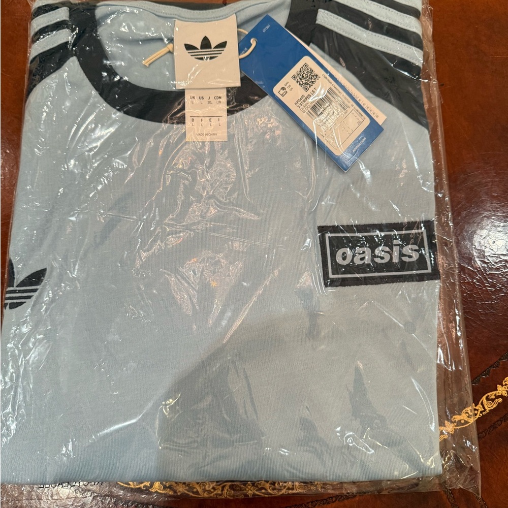 Oasis Adidas navy long sleeve  unopened from Toronto tour date.